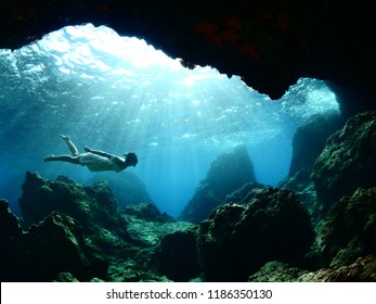 Woman Lady Free Diving Apnea Underwater Cave Sun Beams And Rays Ocean Scenery With Human