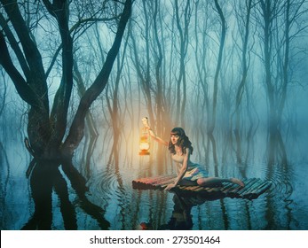 Woman With Lantern Floating On The Lake In The Misty Forest In Rustic Dress. Beautiful Fairy Tale.