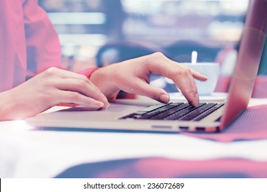 Woman With Laptop In Cafe Shop