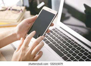 Woman with laptop and cellphone at home - Shutterstock ID 532515079