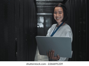 Woman with laptop, server room and information technology, smile in portrait with engineer and datacenter Software update, cybersecurity and network with Asian female setting up firewall and database - Powered by Shutterstock