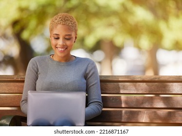 Woman, Laptop And Smile In Park While On Social Media, Reading Or Writing On Web. Black Woman, Writer And Happy With Computer In Sunshine To Relax Outdoor By Trees For Study, Poetry And Technology