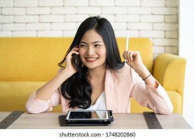 Woman Laughing Happily In Online Sales. A Joyful Plus Active Woman Works On Her Extra Part Time Job To Earn Double Income From Home And Office.  