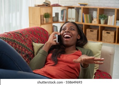 Woman laughing when talking on phone with friend