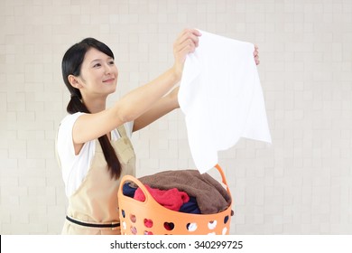 Woman With A Laundry Basket