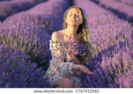 Similar – Woman posing in field of white flowers