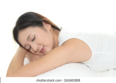 A Woman Laying Down On The Bed