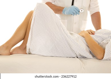 A Woman Laying In A Hospital Gown Legs Showing And A Doctor With A Stethoscope.