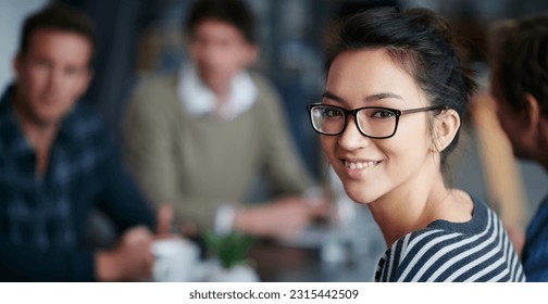 Woman leader, portrait and startup team in blurred background, meeting and smile with confidence. Young businesswoman, leadership and happy with group, workplace or creativity in collaboration at job - Powered by Shutterstock