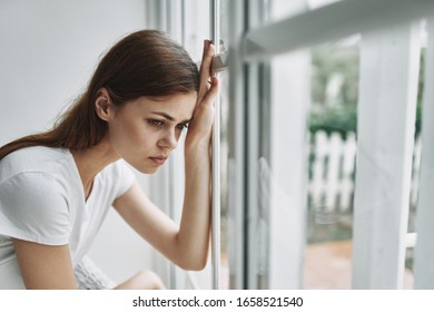 woman leaned her hand on the side window - Shutterstock ID 1658521540
