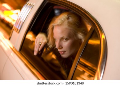 Woman Leaning Out Of Limousine Window