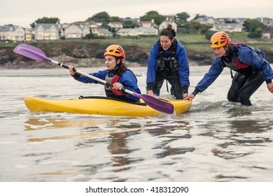 Woman Learning How To Sea Kayak, Cornwall, England