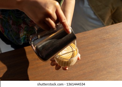 Woman Learning To Make Latte Art.