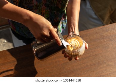 Woman Learning To Make Latte Art.