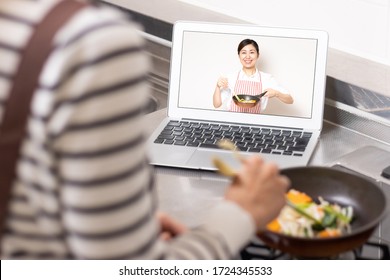 Woman Learning In An Online Cooking Class