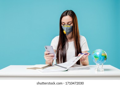 Woman Learning With Planet Earth Globe And Phone With Books Wearing Mask On Blue Background