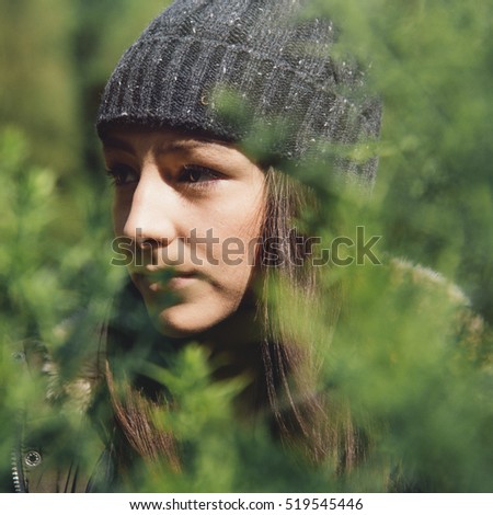 Similar – ein Mädchen mit langen Haaren und blauen Augen in den Bergen, das mit einer Kapuze lächelt