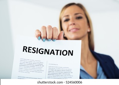 Woman Leaving A Worthless Job Showing Her Resignation Letter