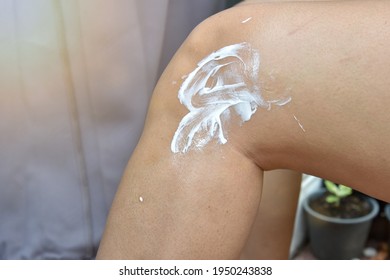 Woman Leg Apply The Balm On Injury Knee, Pain From Sport Woman Use A Cream To Relief Painful