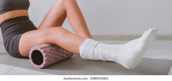 woman with a leg injury in a cast restores muscle function and rehabilitation with mfr massage, myofascial release for ankle injury. Physiotherapy massage - Powered by Shutterstock