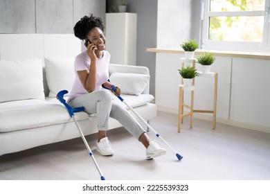 Woman With Leg Injury Using Crutches At Home - Powered by Shutterstock