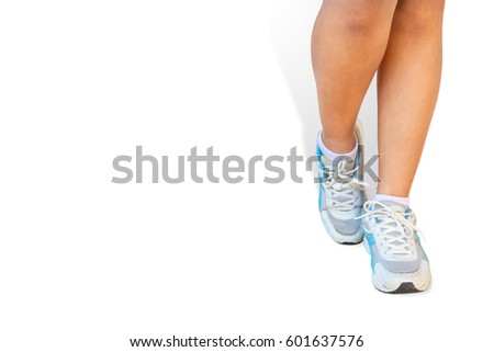 Woman leg and running shoes isolated on a white background with clipping path.