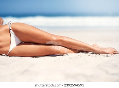 Woman, legs and bikini on beach sand for holiday vacation, resort relax for paradise travel. Female person, feet and swimsuit for outdoor costal trip for summer journey or tanning, clean air at ocean - Powered by Shutterstock