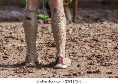 Woman Legs With Dirty Socks With Mud On Extreme Run