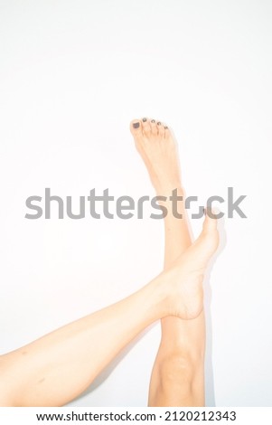 Woman legs and feet with relaxed posture