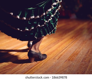 Woman Legs In Flamenco Skirt And Shoes