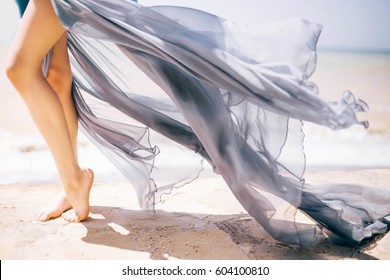 Woman Legs, Girl in Blue Waving Dress, Smooth Skin Leg Tiptoe on White