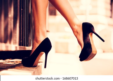 woman legs in high heel shoes outdoor shot - Shutterstock ID 168607013