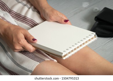 Woman Legs In A High Heels Shoes, Clutch Bag And A Blank Page Notepad. Women Tips. Female Tricks Mock Up. 