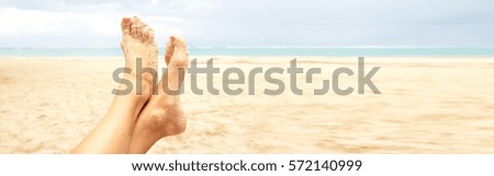 Woman legs on the beach