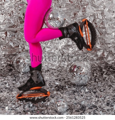 Woman legs in pink leggins with shoes for kangoo jumping on silver foil background with disco balls
