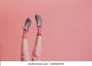 Woman Legs In Pink Pants Up In The Air