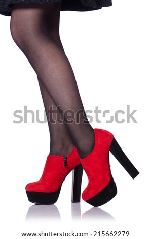 Woman legs with red shoes isolated on the white