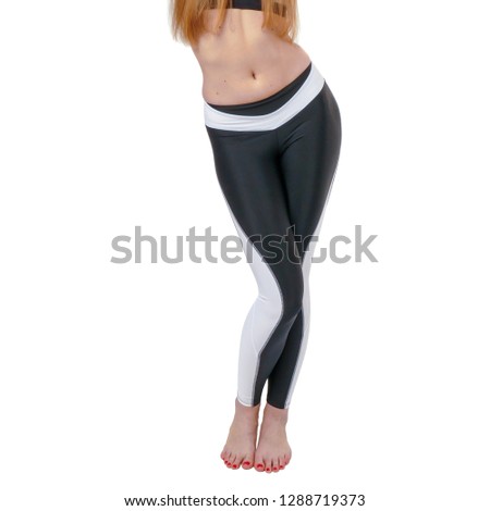 Woman legs in sport, fitness black and white dress, isolated on white background