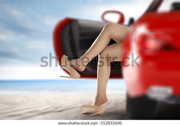 woman legs in sport red car\
