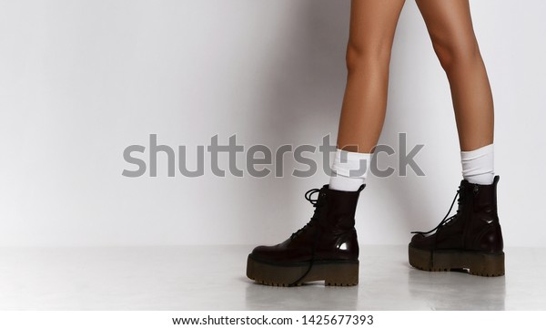 Woman Legs Walking Leather Black Boots 