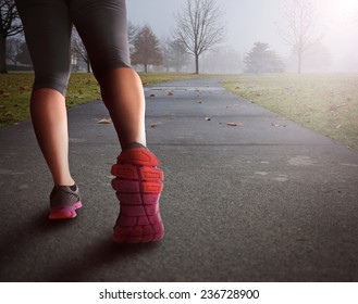 Woman Legs Walking Path In Park In Fog Covered Morning Background