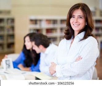 Woman at the library working as a librarian - Powered by Shutterstock