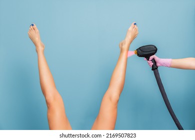 Woman lifted her beautiful legs apart. Blue background. The concept of hair removal, depilation, epilation and shaving. - Shutterstock ID 2169507823