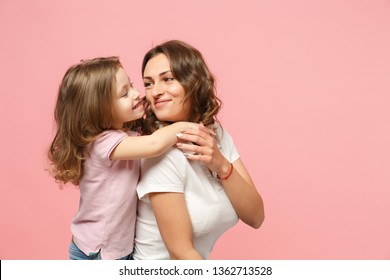 Woman In Light Clothes Have Fun With Cute Child Baby Girl. Mother, Little Kid Daughter Isolated On Pastel Pink Wall Background, Studio Portrait. Mother's Day Love Family, Parenthood Childhood Concept