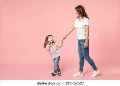 Woman In Light Clothes Have Fun With Cute Child Baby Girl. Mother, Little Kid Daughter Isolated On Pastel Pink Wall Background, Studio Portrait. Mother's Day Love Family, Parenthood Childhood Concept