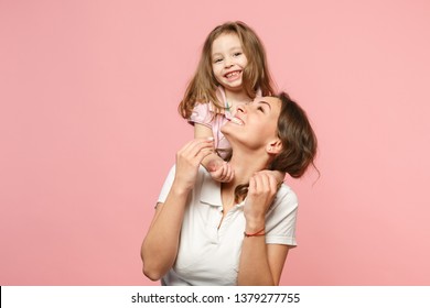 Woman In Light Clothes Have Fun With Cute Child Baby Girl. Mother, Little Kid Daughter Isolated On Pastel Pink Wall Background, Studio Portrait. Mother's Day Love Family, Parenthood Childhood Concept