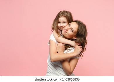 Woman In Light Clothes Have Fun With Cute Child Baby Girl. Mother, Little Kid Daughter Isolated On Pastel Pink Wall Background, Studio Portrait. Mother's Day Love Family, Parenthood Childhood Concept