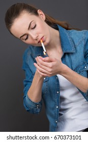 Woman Lighting A Cigarrette