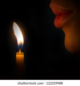 Woman Lips Blowing To The Candle