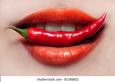 Woman lips and chili pepper